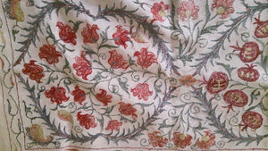 Suzani hand-embroidered silk fabric with pomegranade